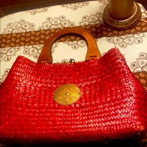 A burgundy handcrafted unique purse